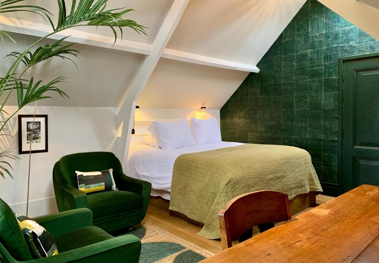 Boutique Hotel Villa Trompenberg ฮิลเวอร์ชุม ภายนอก รูปภาพ